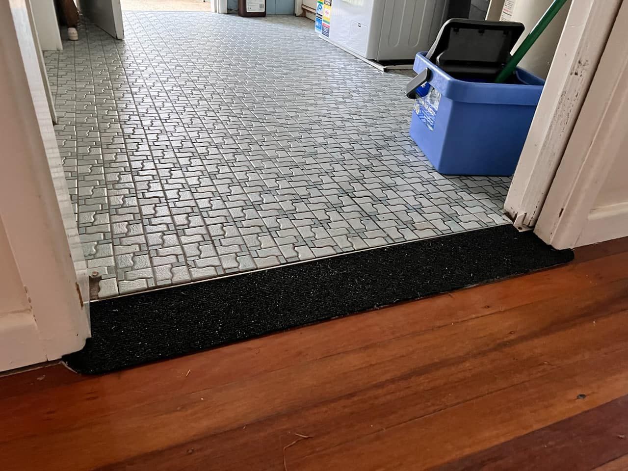 Wooden Floor Transitions to a Mosaic Tile Floor — Alcando Renovations and Maintenance In Taree, NSW