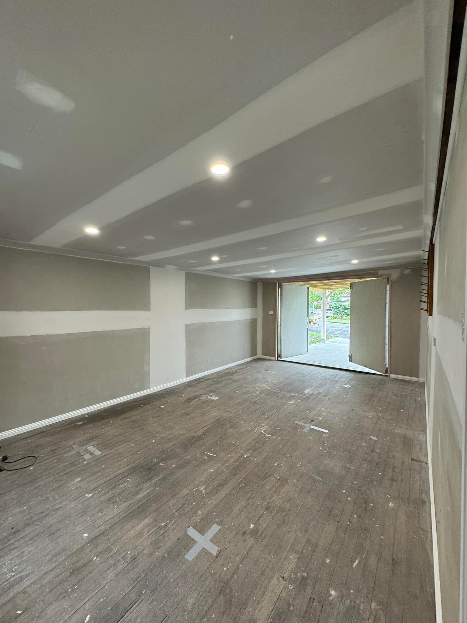 Interior of a Room Under Construction With Gray Walls — Alcando Renovations and Maintenance In Harrington, NSW