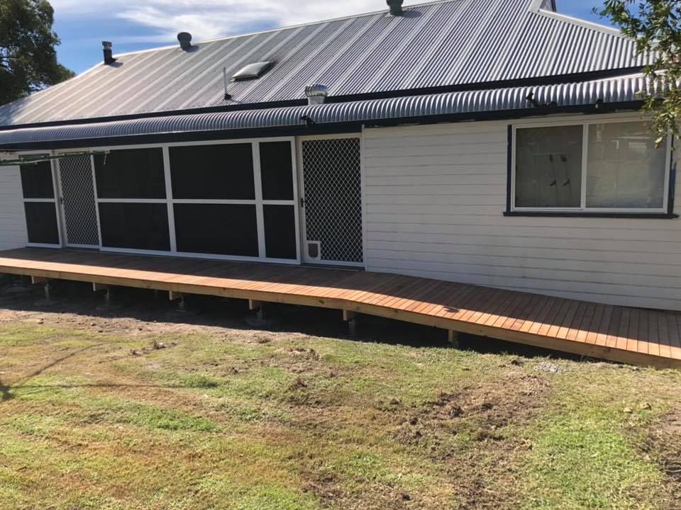 Wooden Ramp Leading to a White House — Alcando Renovations and Maintenance In Bobin, NSW