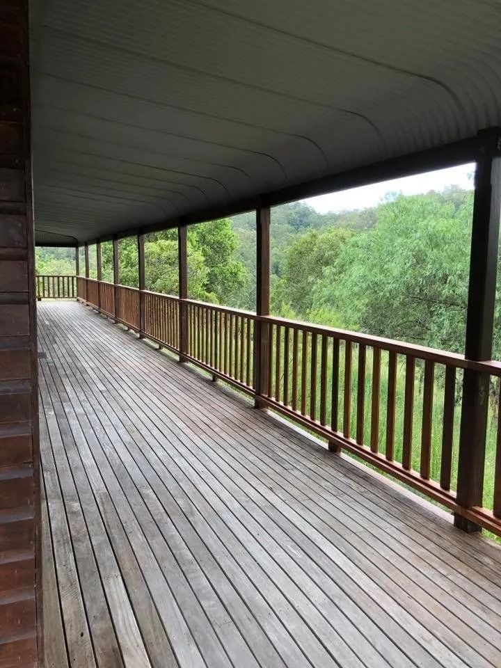 Wooden Veranda Overlooking Lush Green Trees — Alcando Renovations and Maintenance In Bobin, NSW