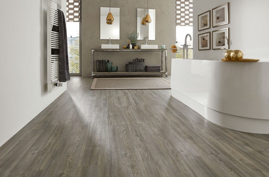 A bathroom with a wooden floor and two sinks