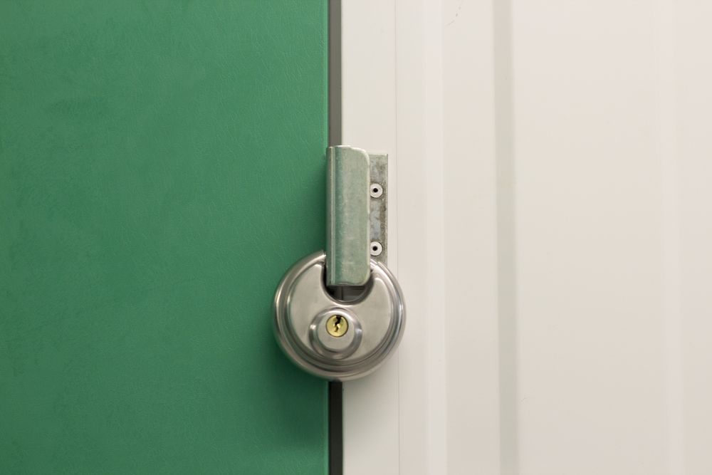 A Close Up of a Padlock on a Green Door — Huskisson Self Storage in Erowal Bay, NSW