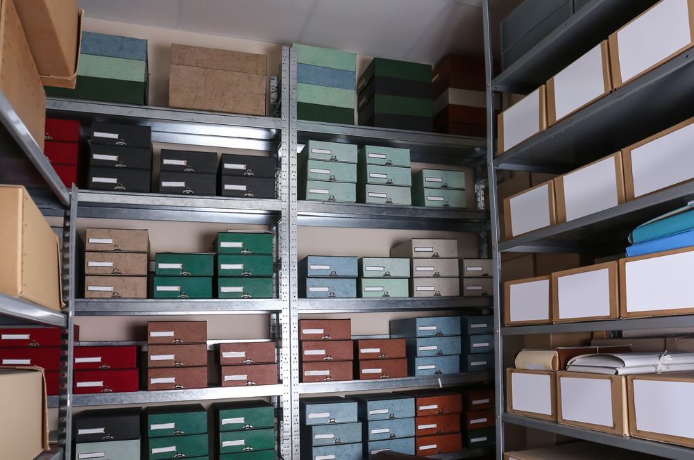 A Warehouse Filled With Lots of Boxes and Shelves — Huskisson Self Storage in Huskisson, NSW