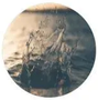 A blurry circular view of water with a small boat silhouette in the center.