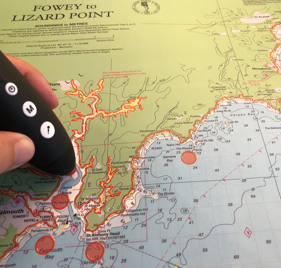 A picture of one of the talking and touchable charts produced by Imray available from SVT. The chart is of Southern Cornwall. A talking pen is being held on one of the descriptive spots. A picture of one of the talking and touchable charts produced by Imray available from SVT. The chart is of Southern Cornwall. A talking pen is being held on one of the descriptive spots.