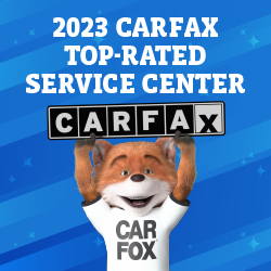 Car Fox mascot holding a 