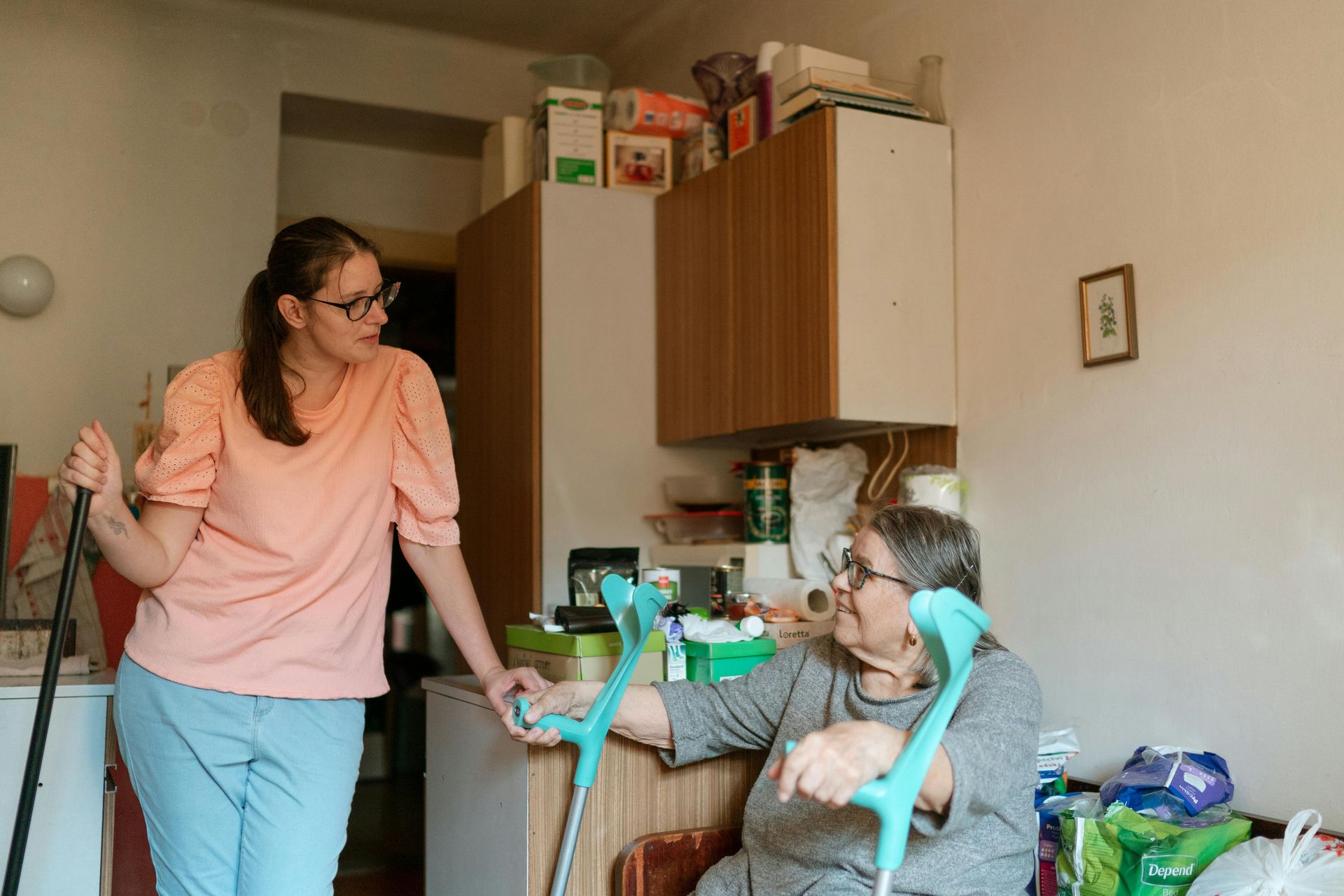 Senior care at home - compassionate caregiver supporting senior