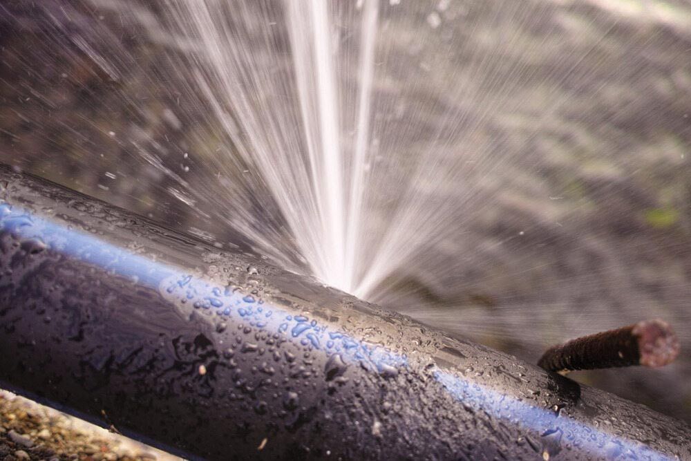 A Pipe is Leaking Water and Water is Coming Out of It — Rock Plumbing & Gasfitting In Cannonvale, QLD