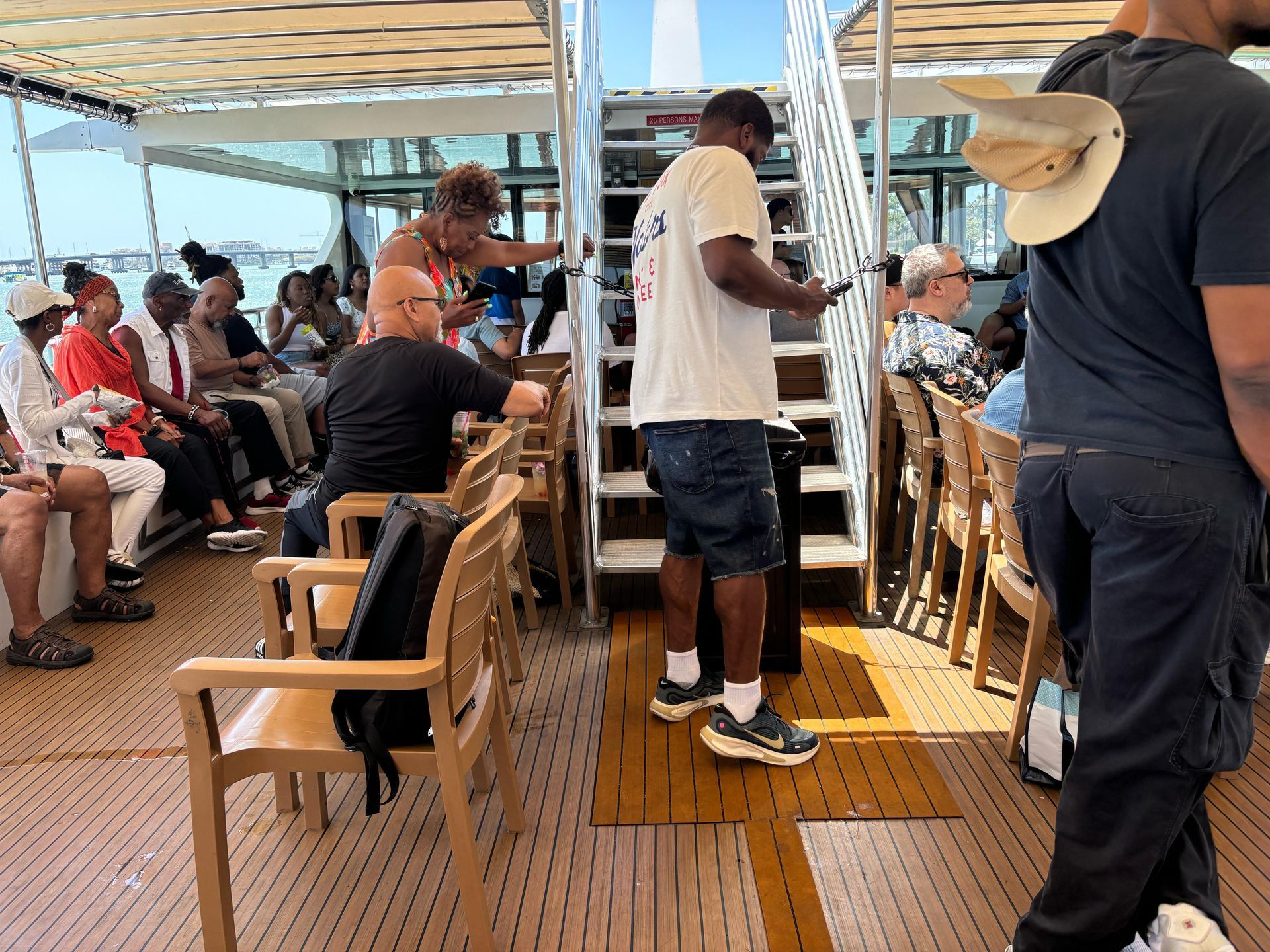 View of the lively lower deck on a Miami mansion boat tour with guests on board