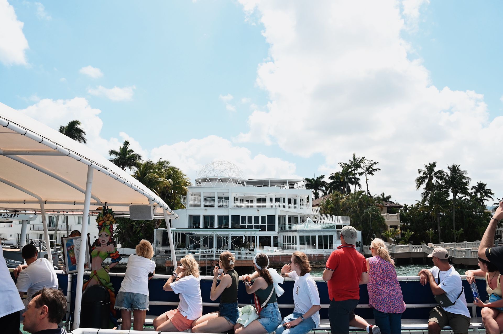 Miami boat tours with passengers looking at the Mansions