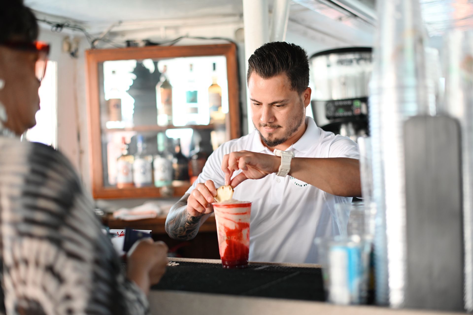 Celebrity Mansion Tour Promo Code comes with a Mojito Bar on board, bartender making drinks onboard the Miami boat tour