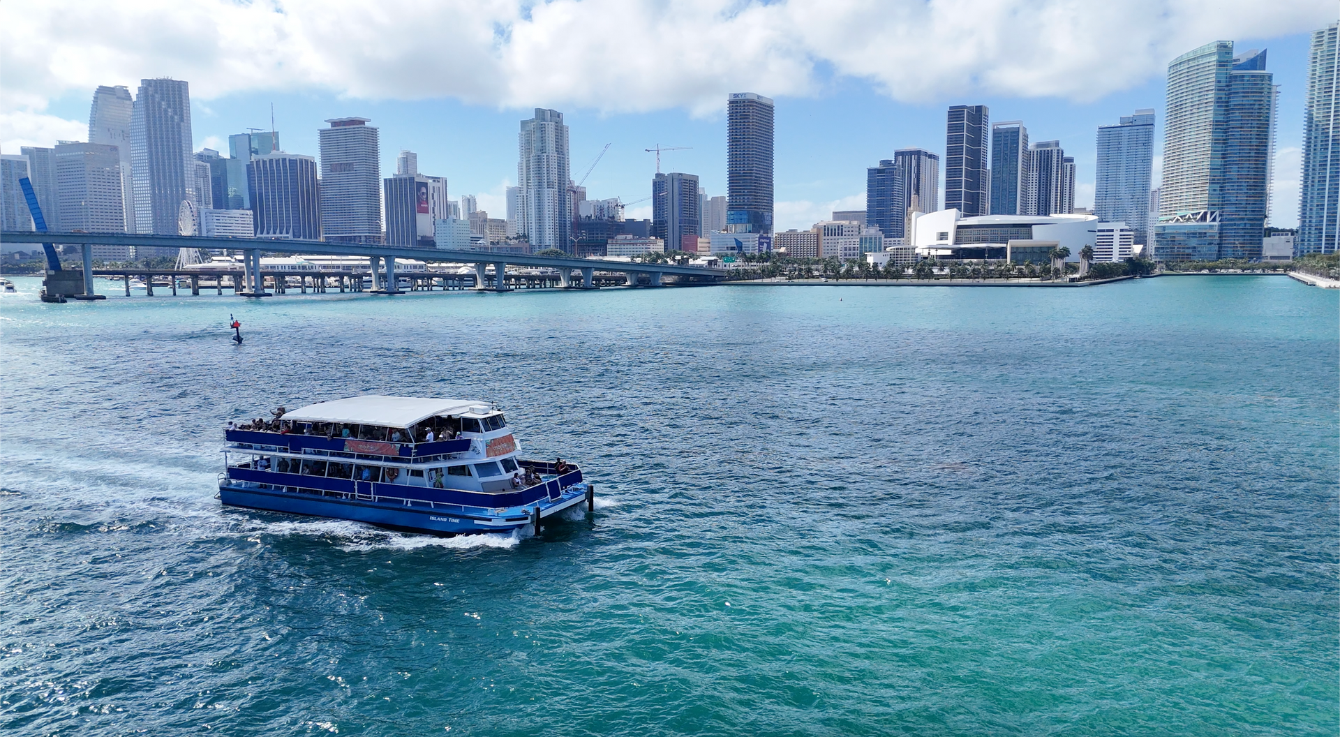 Miami boat tour sailing through Biscayne Bay with Miami skyline views

