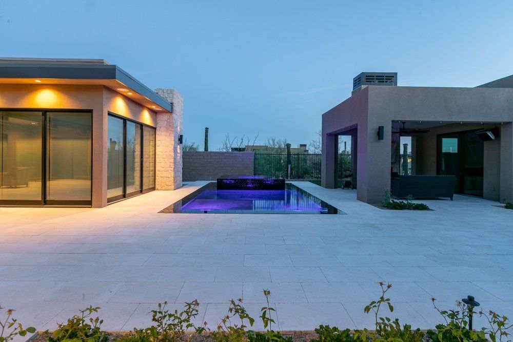 A large house with a swimming pool in the backyard