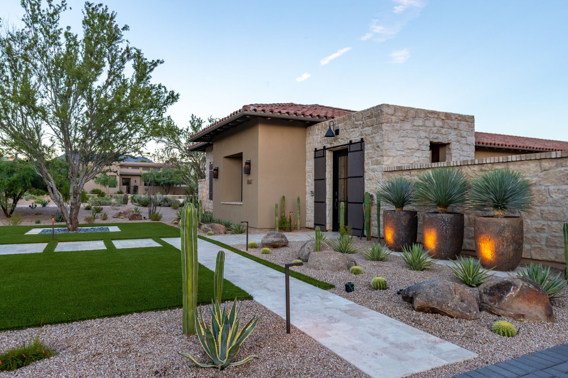 A large house with a walkway leading to it