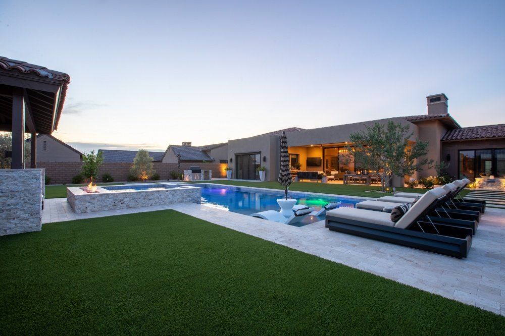 A large house with a swimming pool in the backyard.