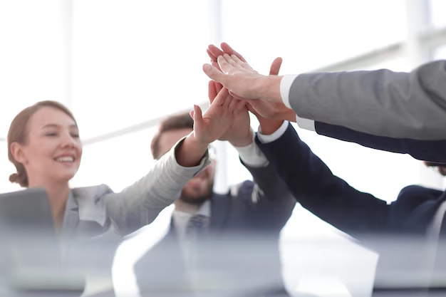 Group of coworkers high fiving