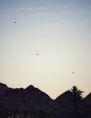 3 drones flying