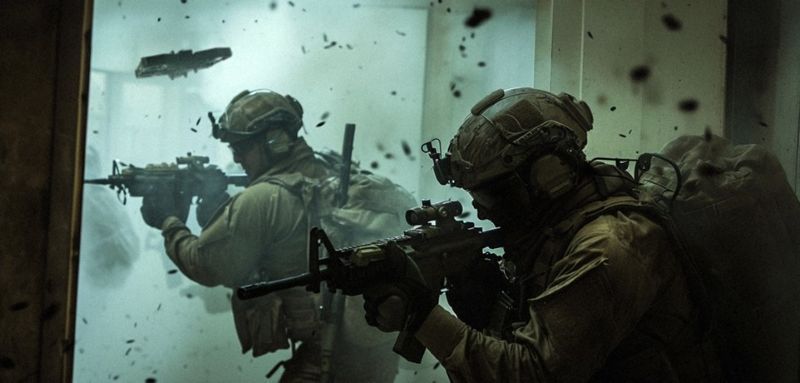 Image of soldiers walking with guns