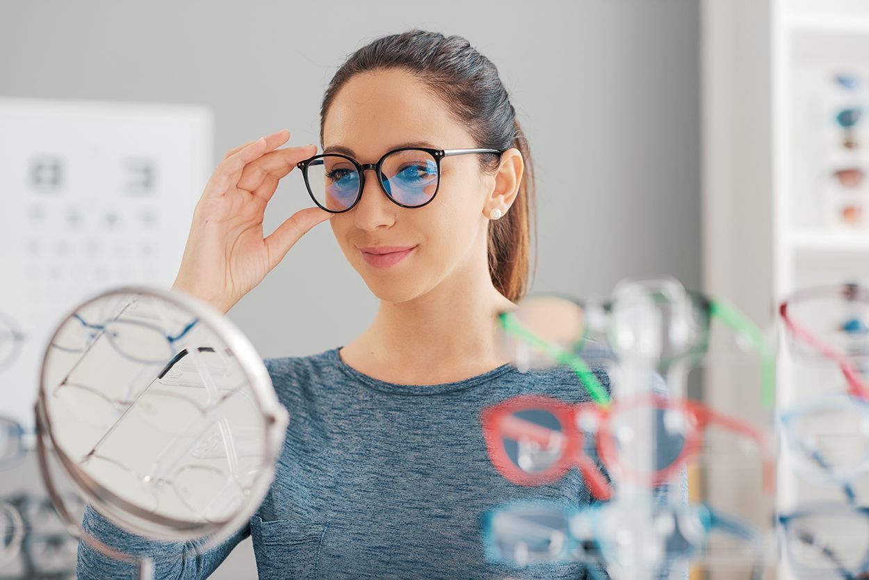 woman trying on eye glasses