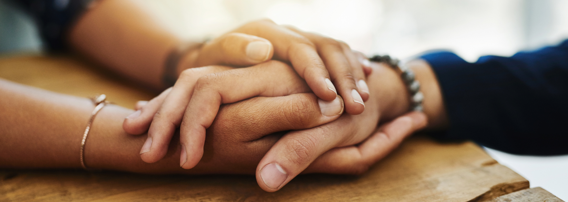 Picture of a person comforting someone else. 
