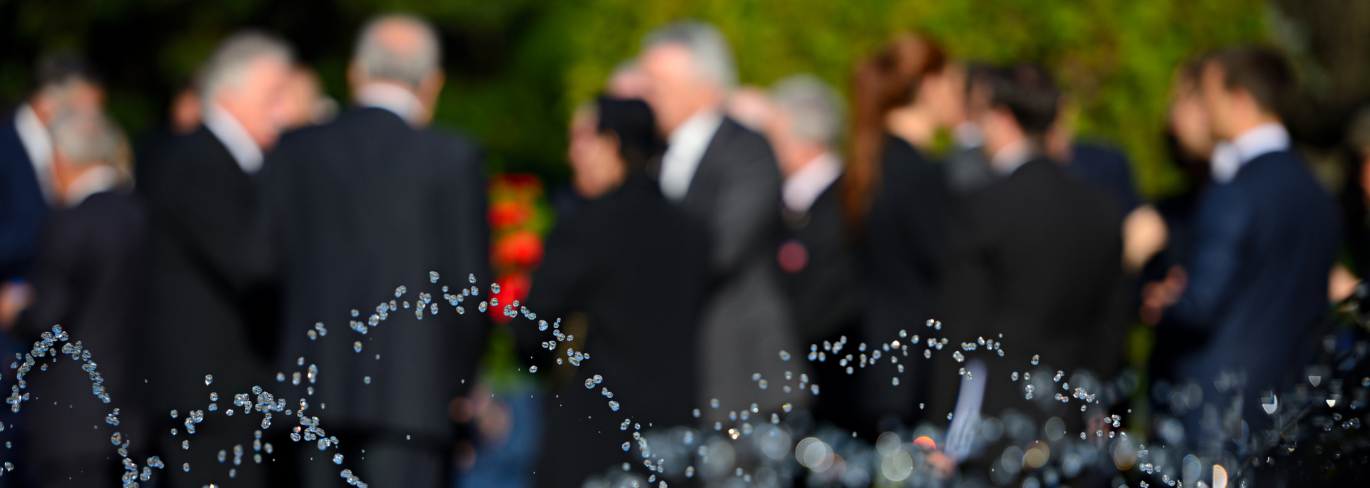 Picture of people gathered for a  memorial service.