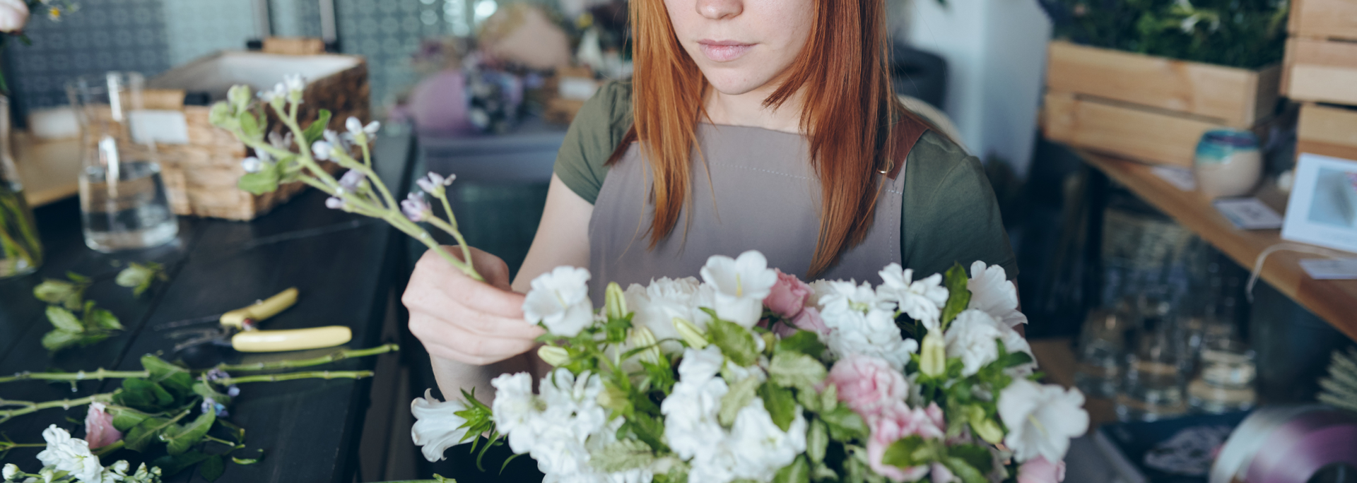 Picture of a person arranging flowers. Picture of a person arranging flowers.