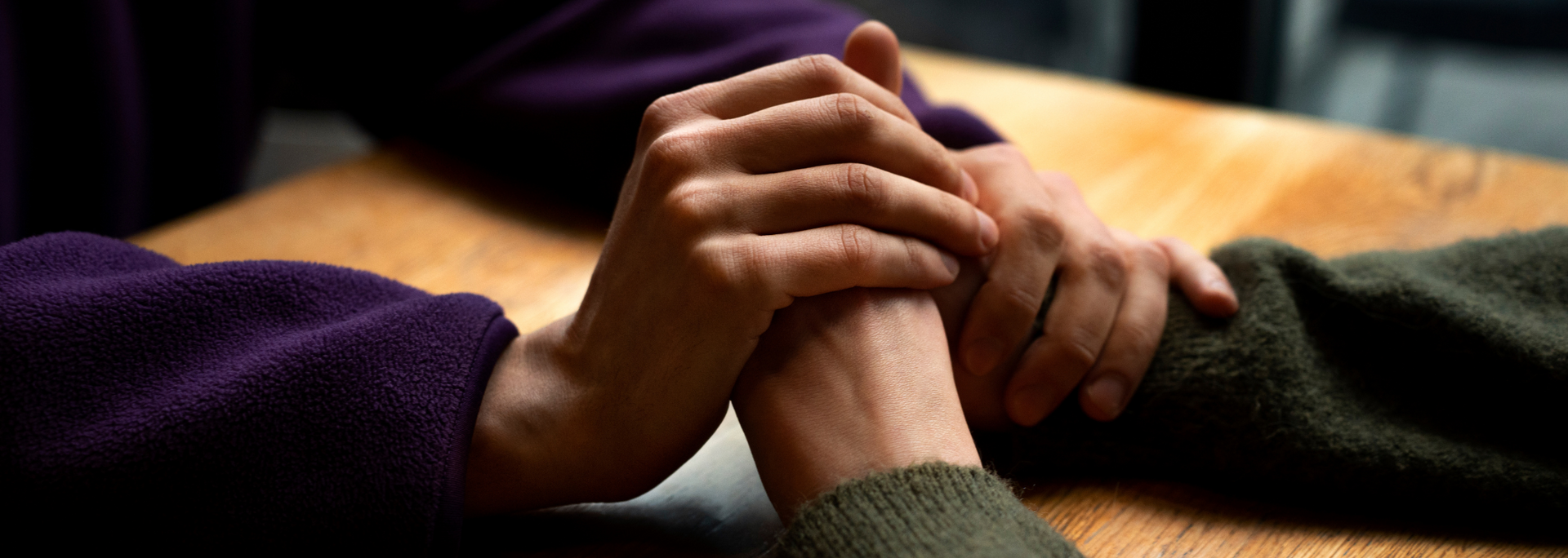Picture of a person comforting another person. Picture of a person comforting another person.p