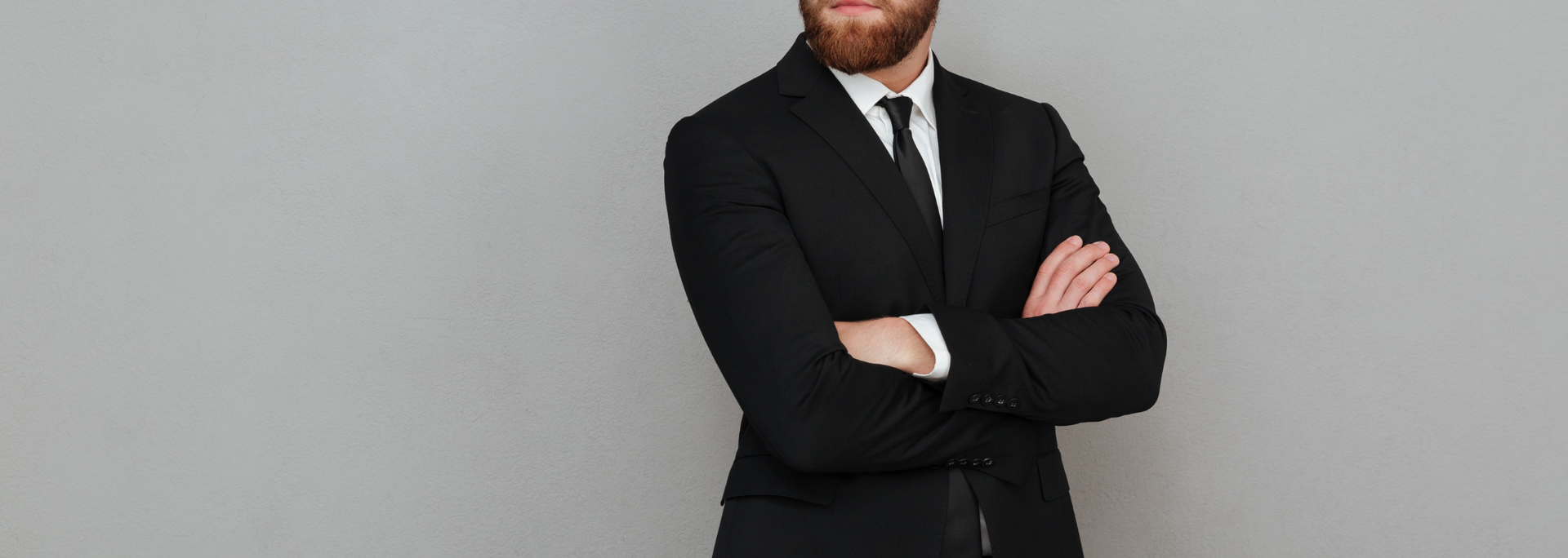 Picture of a person in a dark suit.