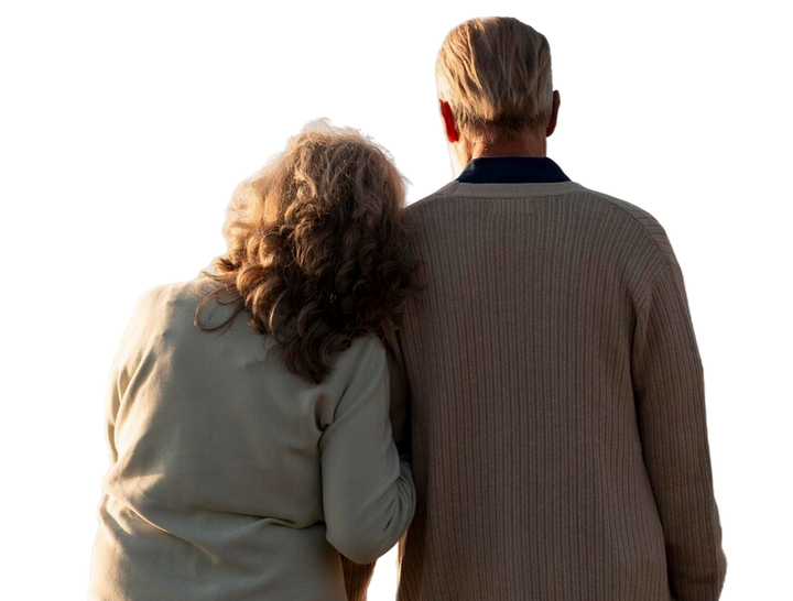 A man and a woman are standing next to each other with their arms around each other.