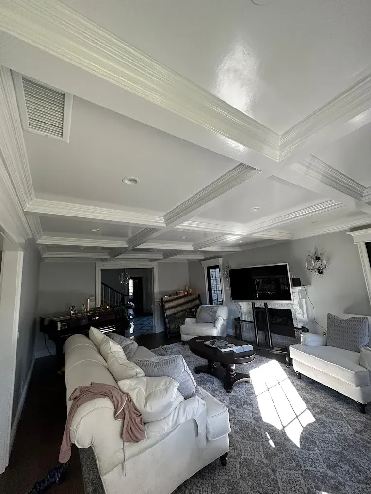 A living room filled with furniture and a piano.