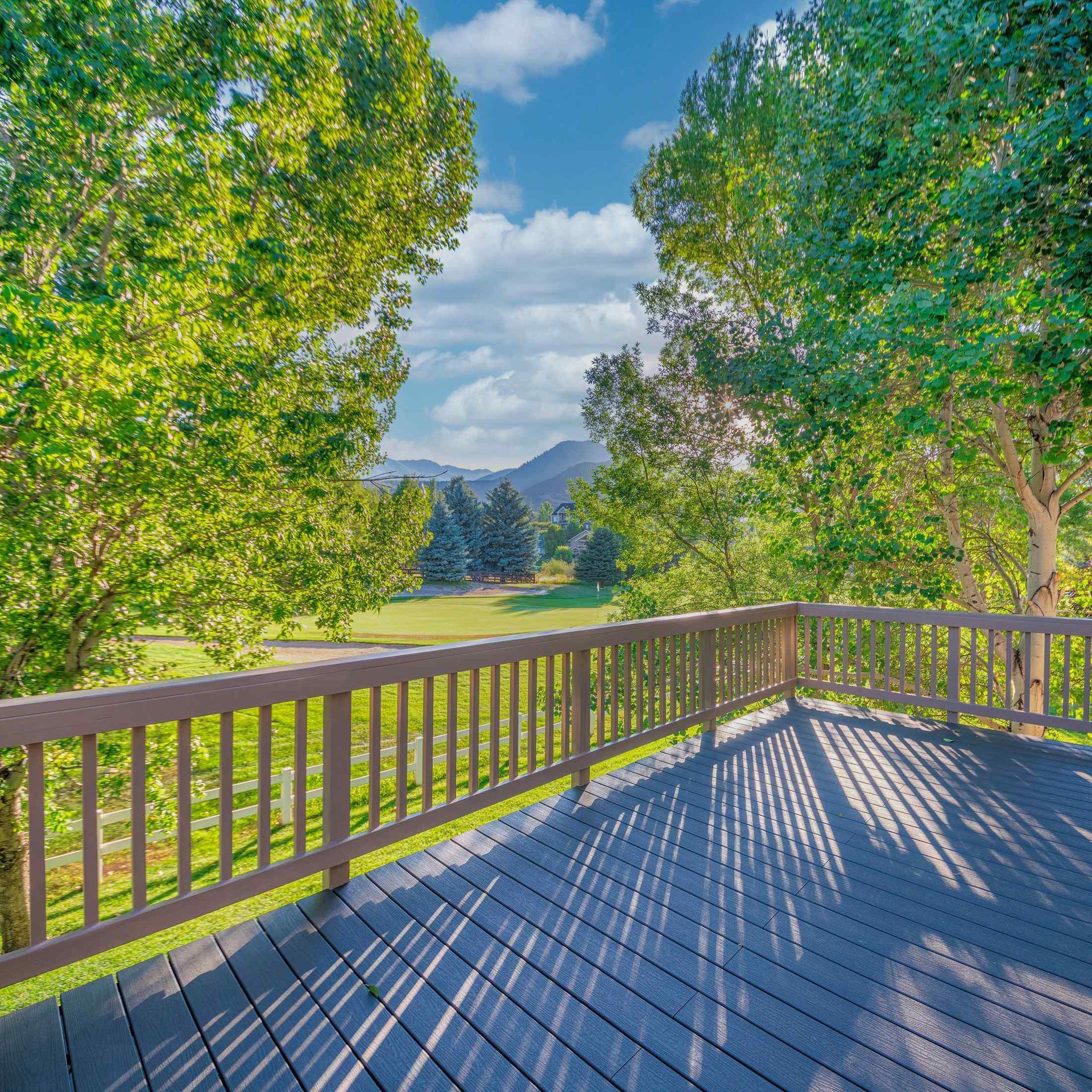 Modern composite deck design trend in Everett WA 2025
Multi-level deck with outdoor dining area in