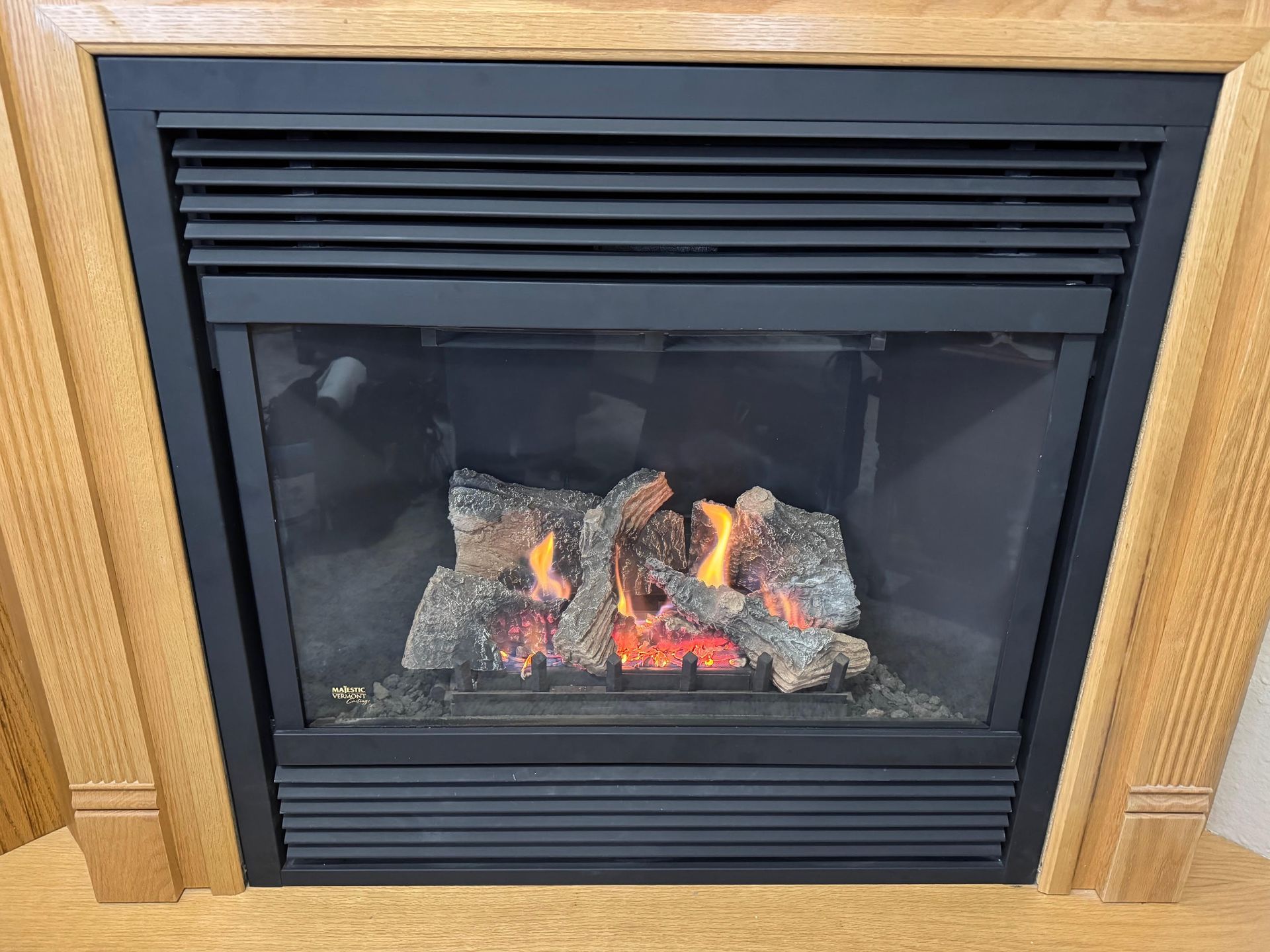 Fireplace burning firewood.
