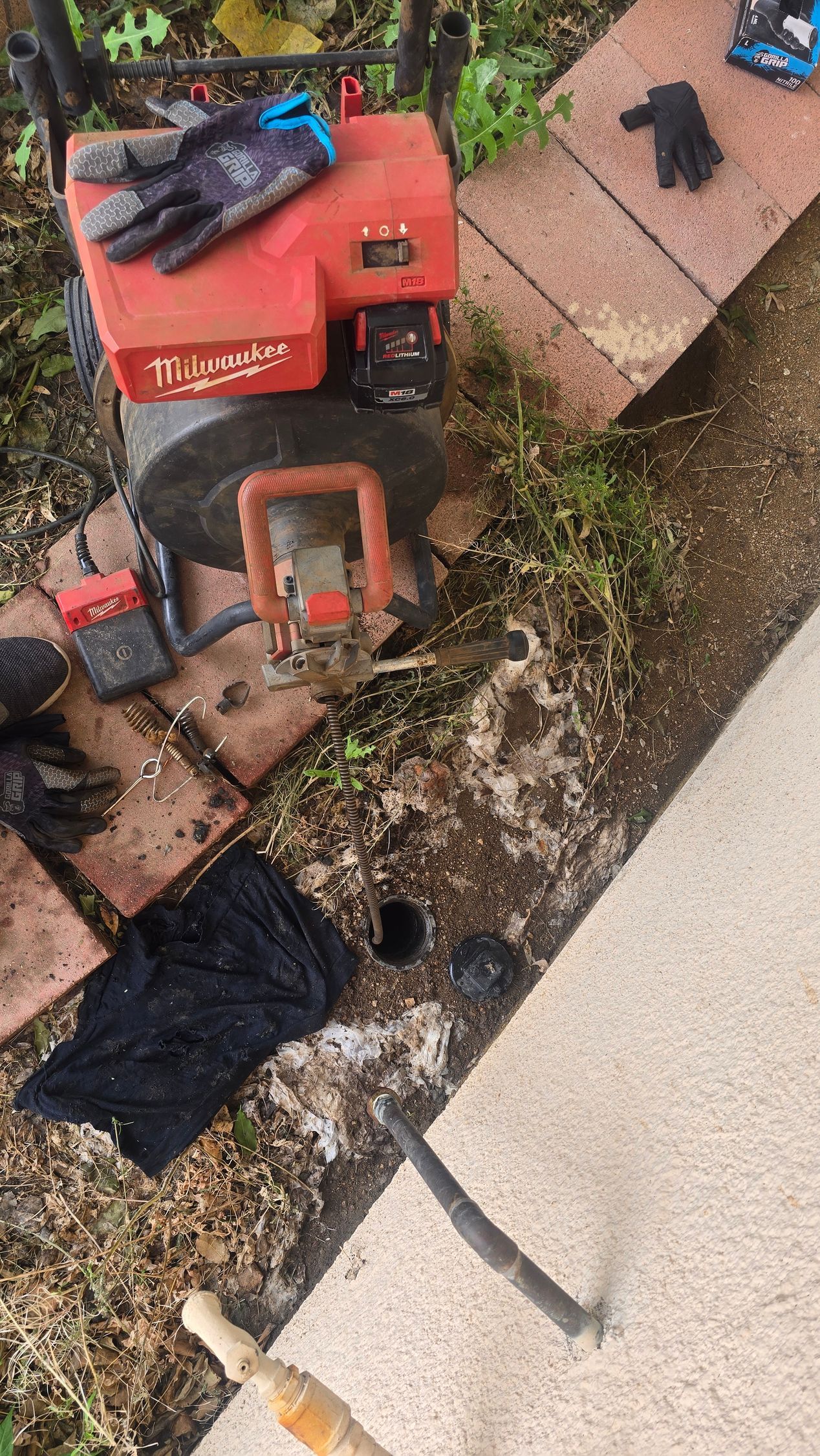 Plumber inspecting a sewer line with a drain camera