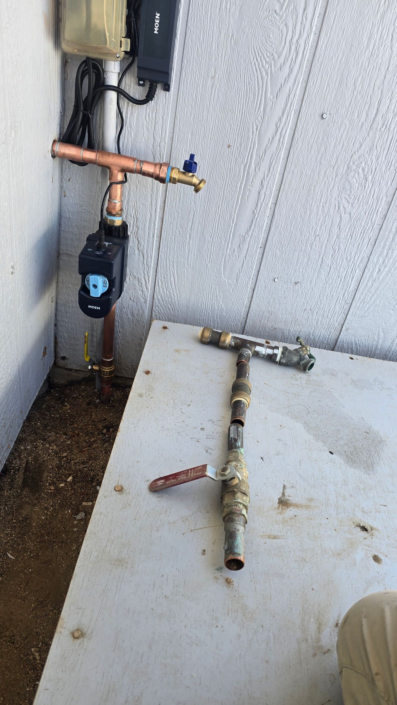 Plumber inspecting a sewer line with a drain camera