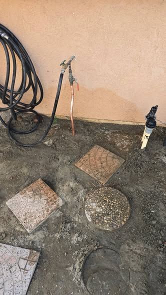Plumber inspecting a sewer line with a drain camera monitor