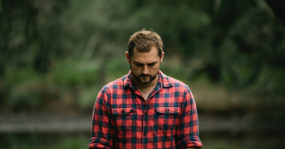 how to prepare for a funeral man wearing checkered shirt