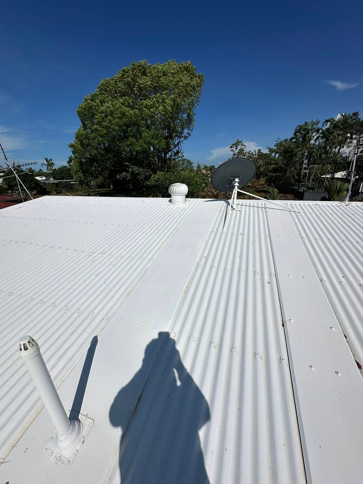 White Corrugated Rooftop Under Blue Sky — I Do It All in Caloundra, QLD