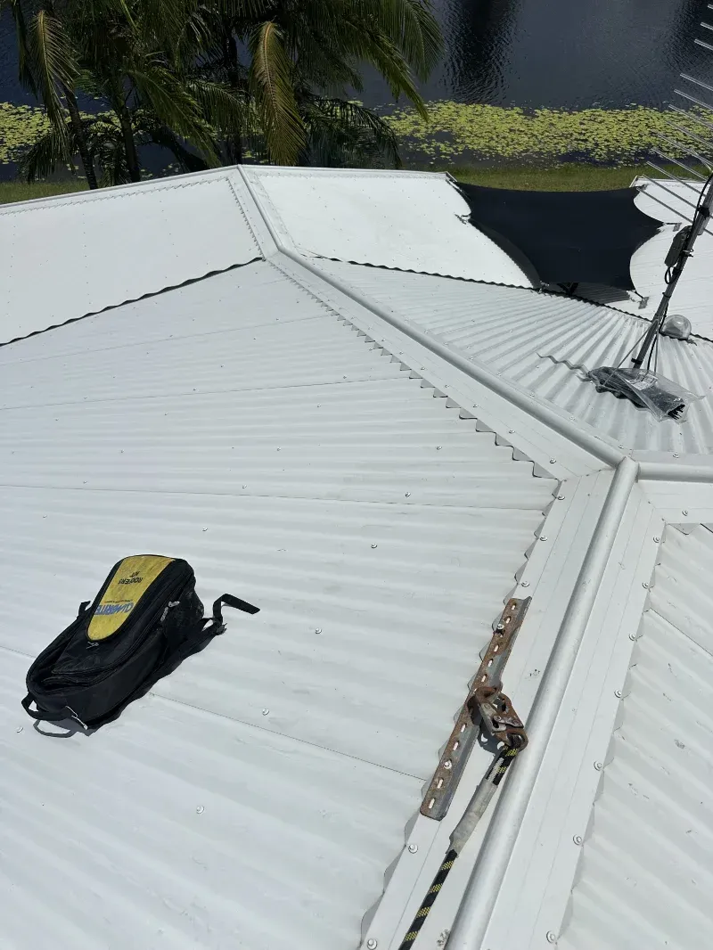 A White Metal Roof with A Black-And-Yellow Tool Bag — I Do It All in Caloundra, QLD