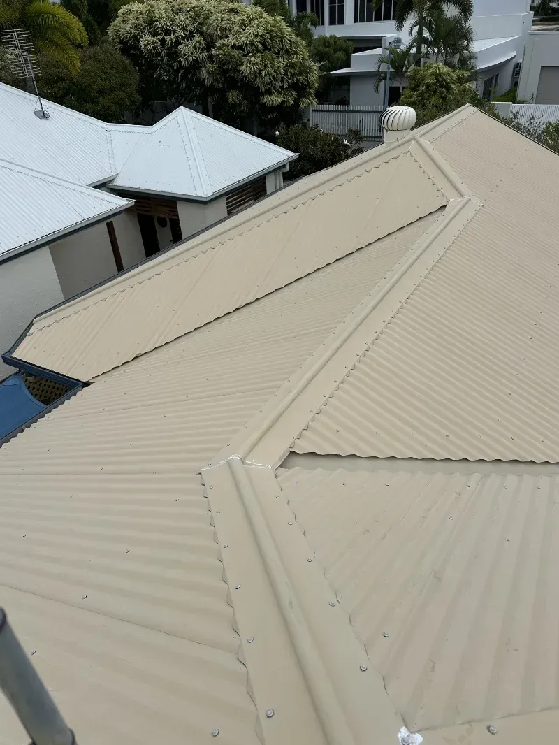 A Light Beige Corrugated Metal Roofs of Houses — I Do It All in Caloundra, QLD