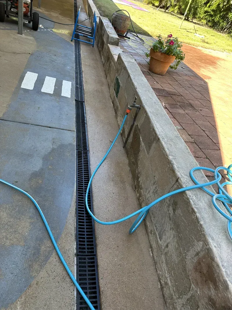 Black Trench Drain Runs Between a Grey Concrete — I Do It All in Maroochydore, QLD