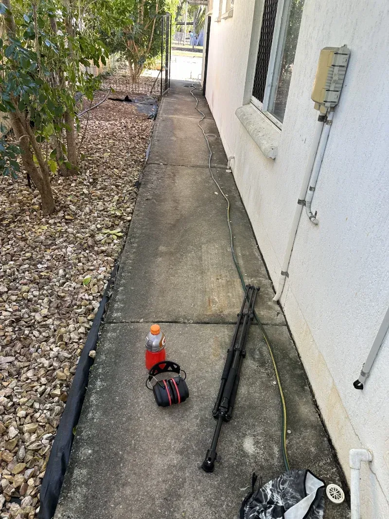 Narrow Concrete Walkway Alongside a House Wall — I Do It All in Noosa, QLD