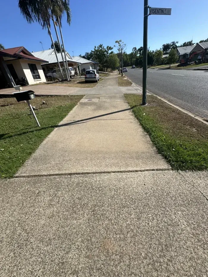 Concrete Sidewalk Leads Toward a Residential Street Corner — I Do It All in Caloundra, QLD