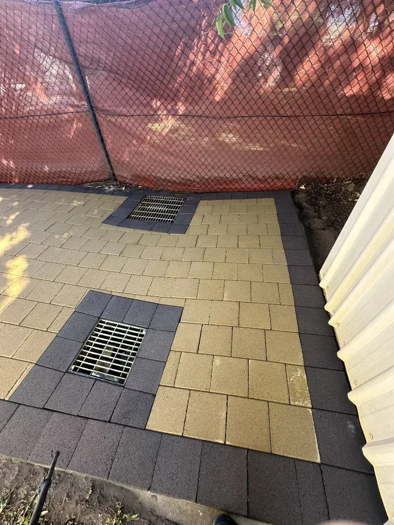 Patio Area Paved With Tan and Dark Grey Rectangular Stones — I Do It All in Maroochydore, QLD