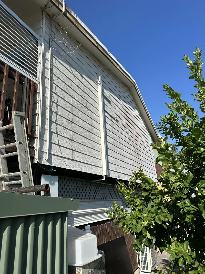 A White-Sided House Exterior with A Ladder — I Do It All in Caloundra, QLD