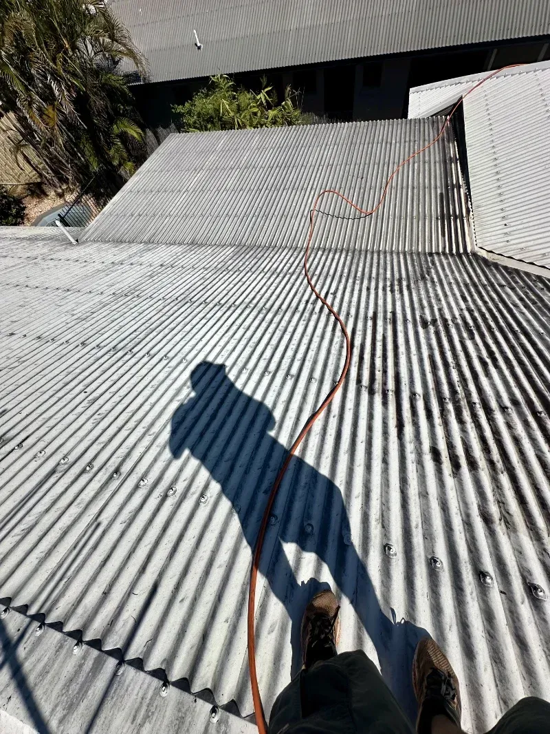 Person’s Shadow and Feet on a White Corrugated Metal Roof — I Do It All in Caloundra, QLD