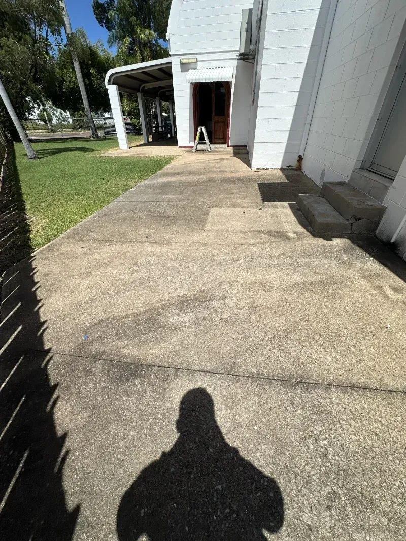 Paved Patio Area Extends From a White Building — I Do It All in Caloundra, QLD