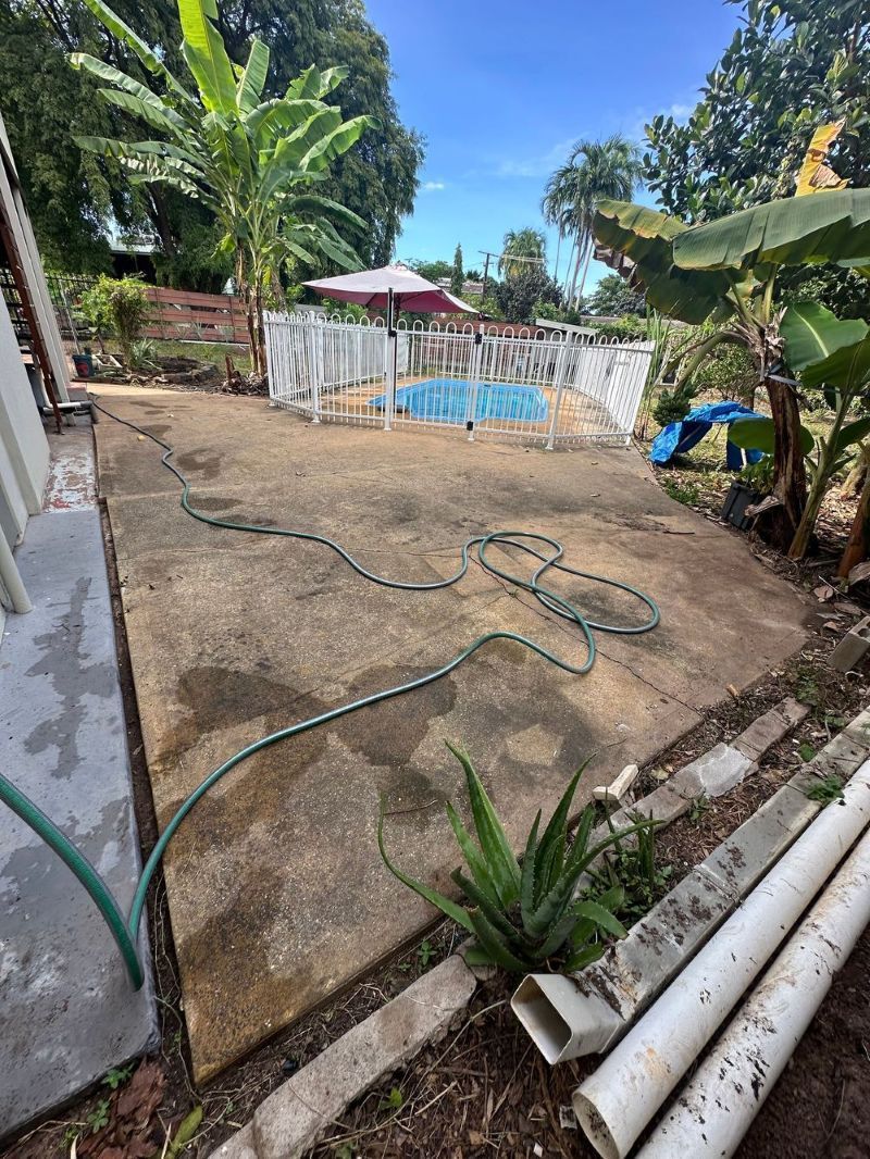 Concrete Patio Area Outdoors With a Garden Hose — I Do It All in Noosa, QLD