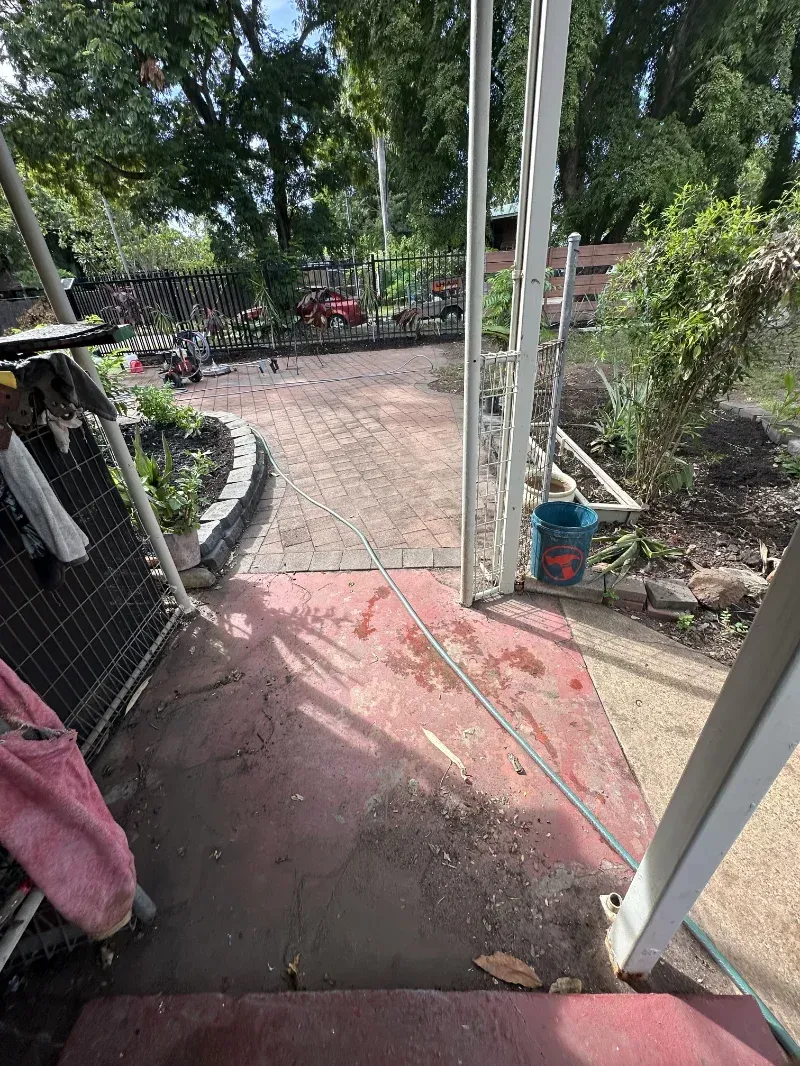 View From a Red Porch Looking Out Onto a Brick Patio — I Do It All in Buderim, QLD