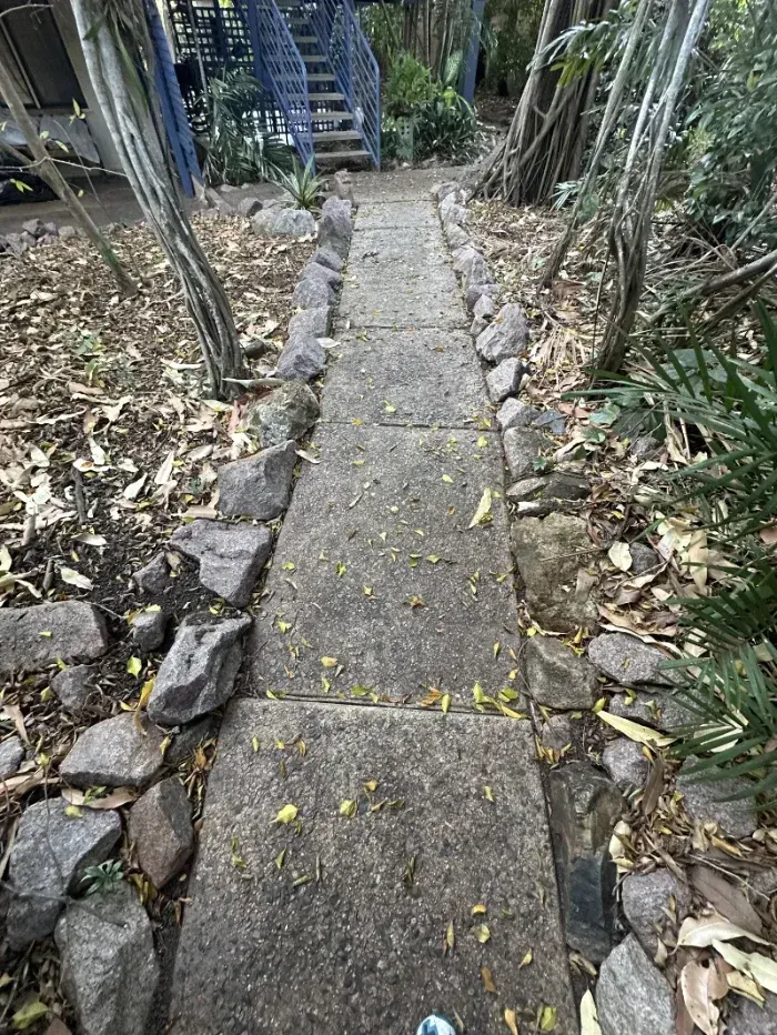Concrete Walkway Lined With Rocks — I Do It All in Caloundra, QLD