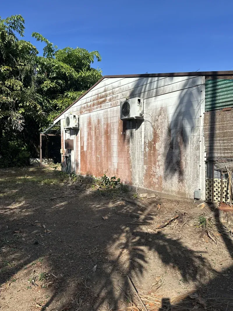 A Corrugated Metal Shed with Peeling Paint and Rust — I Do It All in Caloundra, QLD